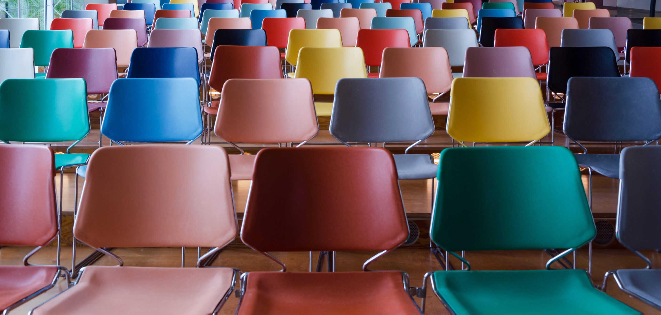 Rows of colorful chairs Rows of colorful chairs in Auditorium